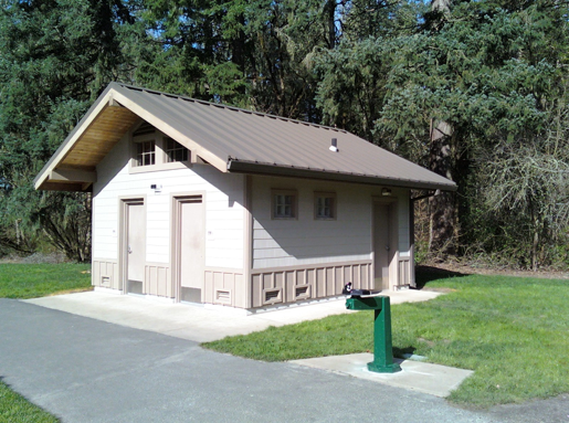 An outdoor house with public restrooms.
