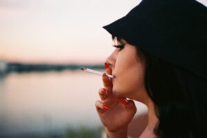 A person smoking a cigarette. 