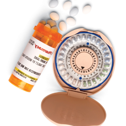An orange medication bottle with tablets falling out. A circular package of anti-pregnancy pills. 