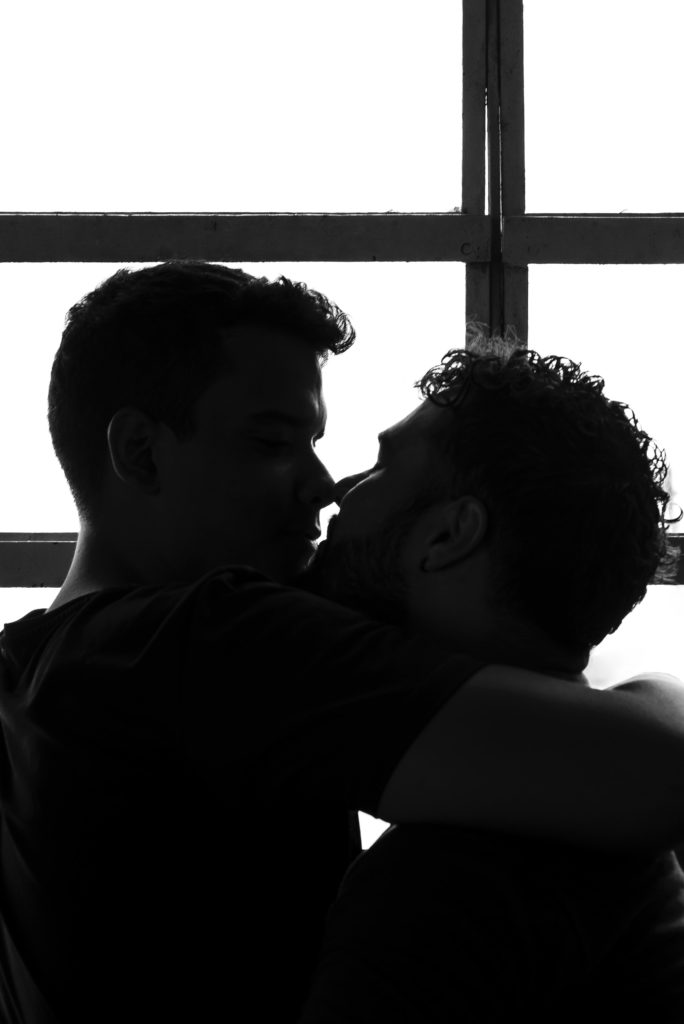 Two people kissing. 