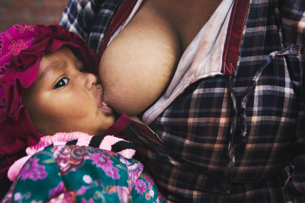 A baby being breast-fed.