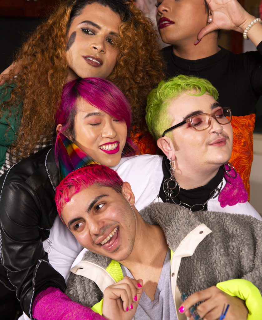 A group of people with colorful hair. 