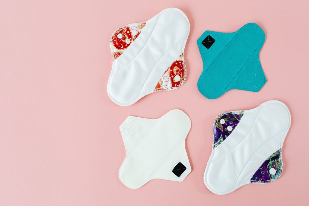 Four reusable menstrual pads.