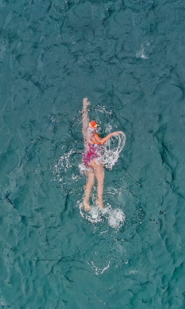 A person swimming in a body of water.