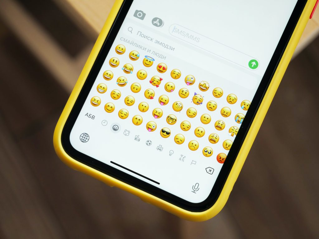 A phone with a variety of emojis.