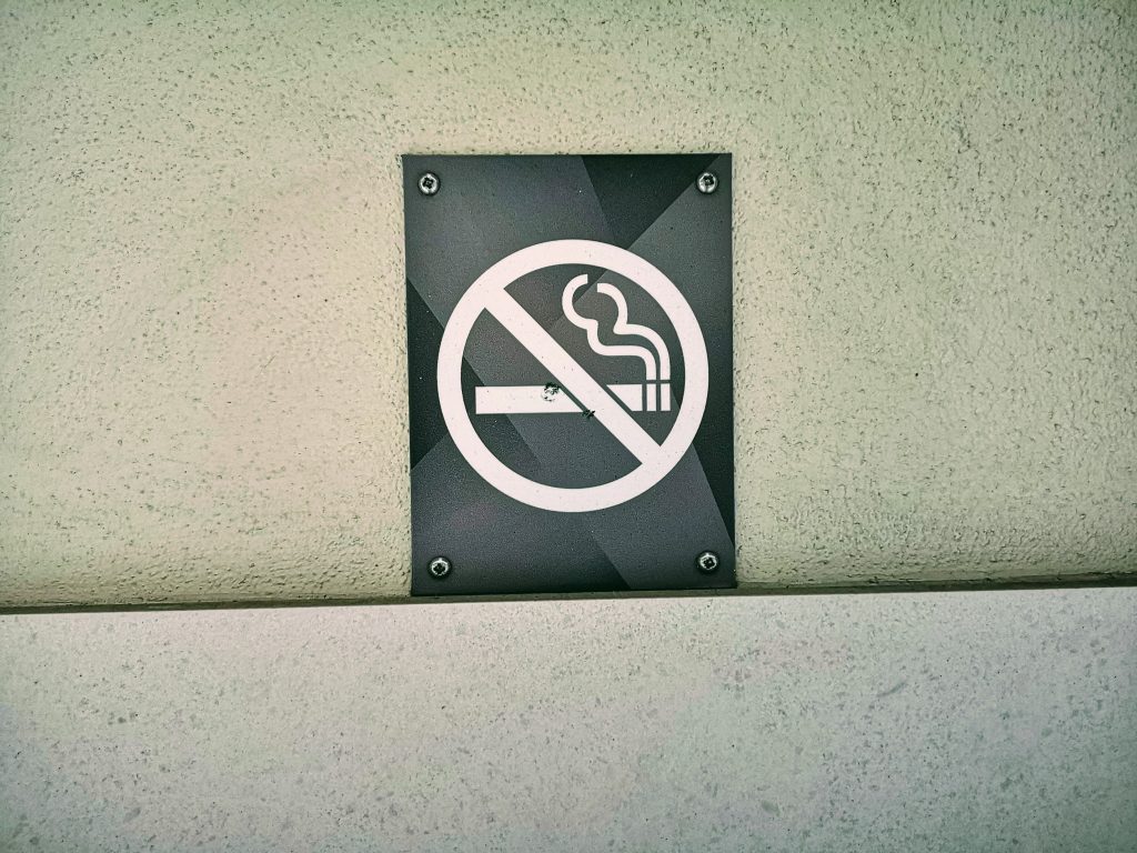 A cigarette sign with a slash across it.