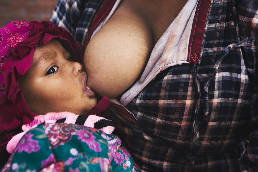 A baby breastfeeding.