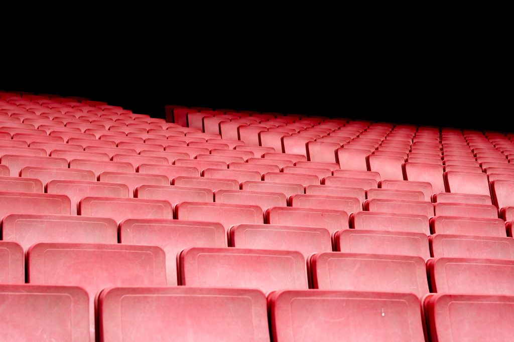 red auditorium chairs with black background