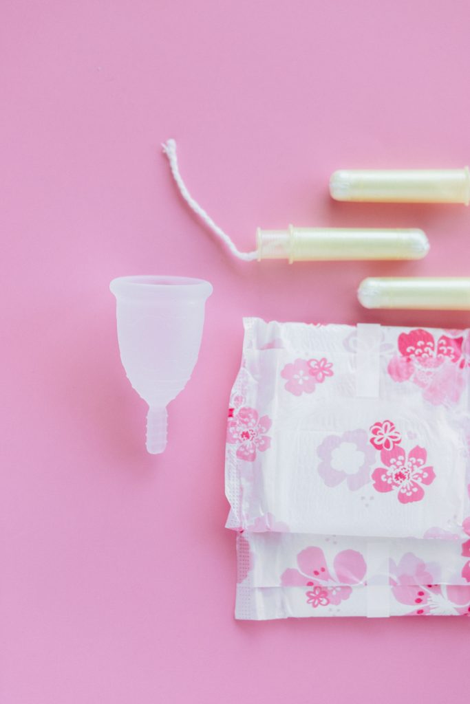 A menstrual cup, two pads, and three tampons.