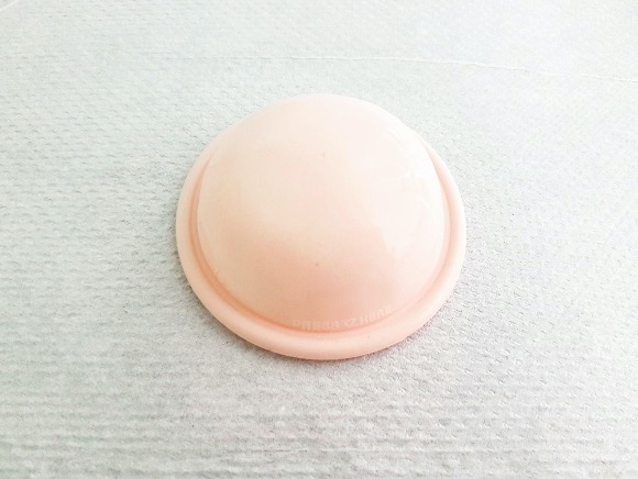 A light pink diaphragm with a white background.