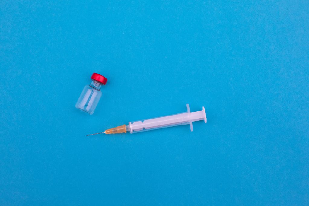 A syringe and a clear tube.