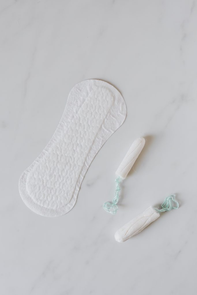 A menstrual pad and two tampons.